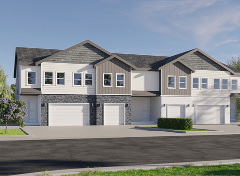 a house with two garage doors on a street